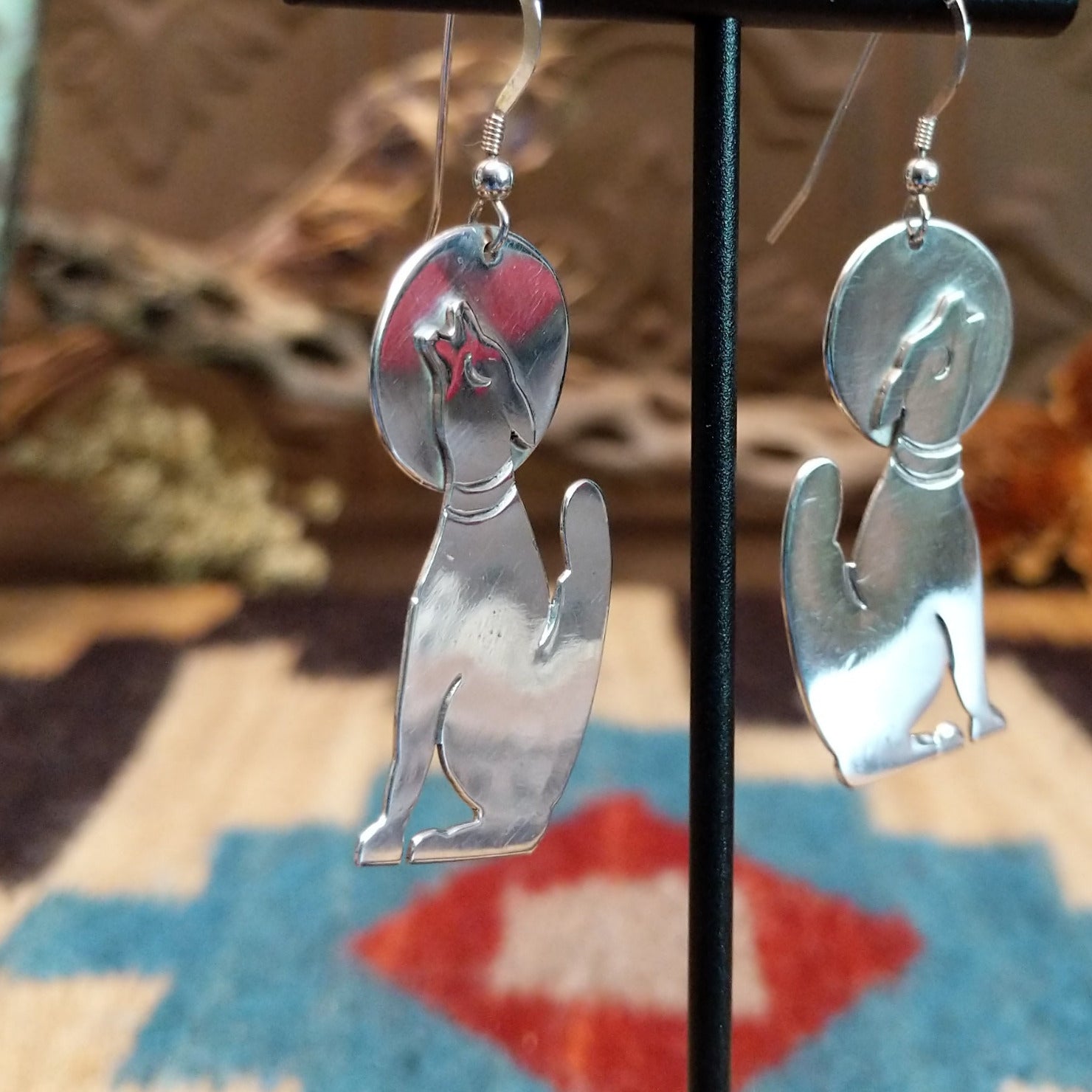 Sterling silver coyote howling at the moon earrings.