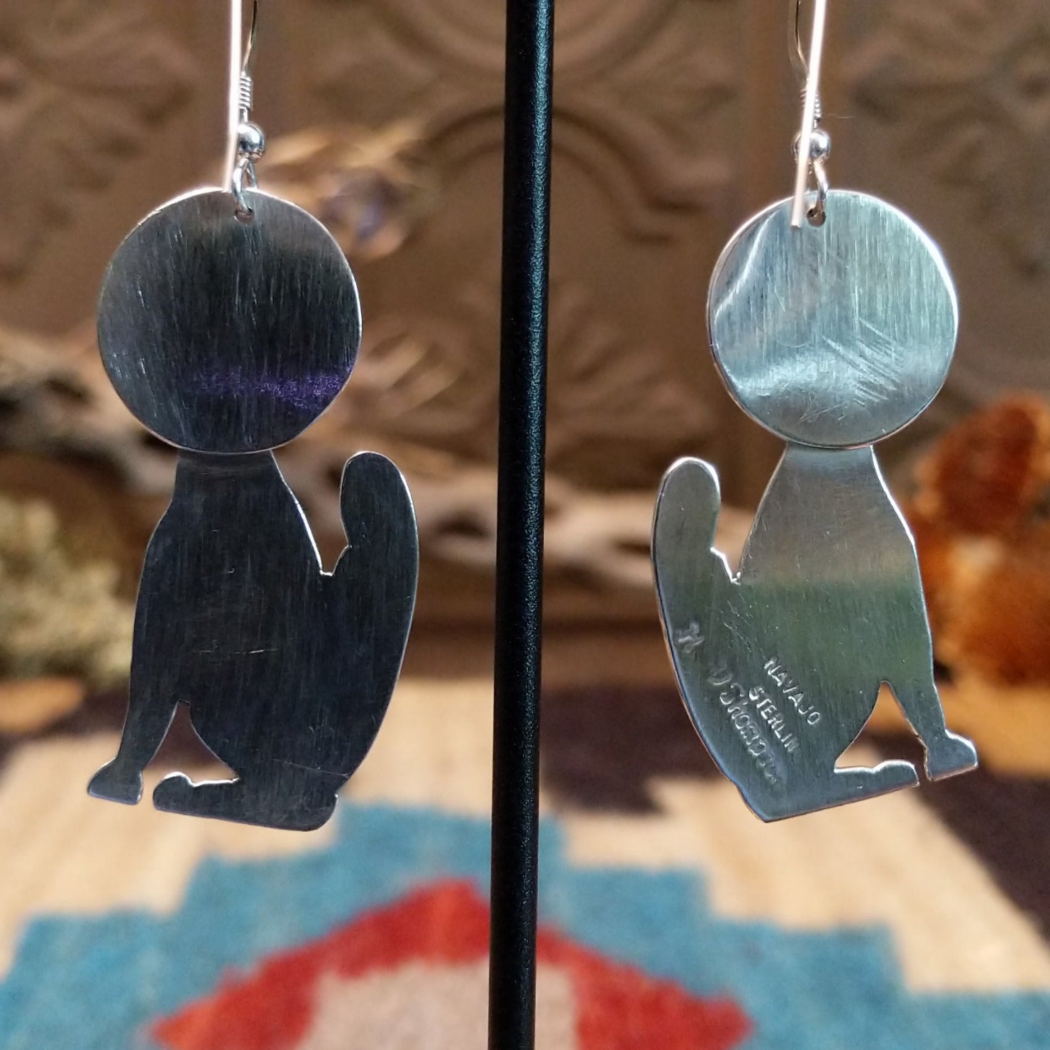 Close-up of the artisans stamped signatures.