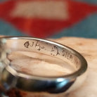 Close-up of the artisan's stamped signature.