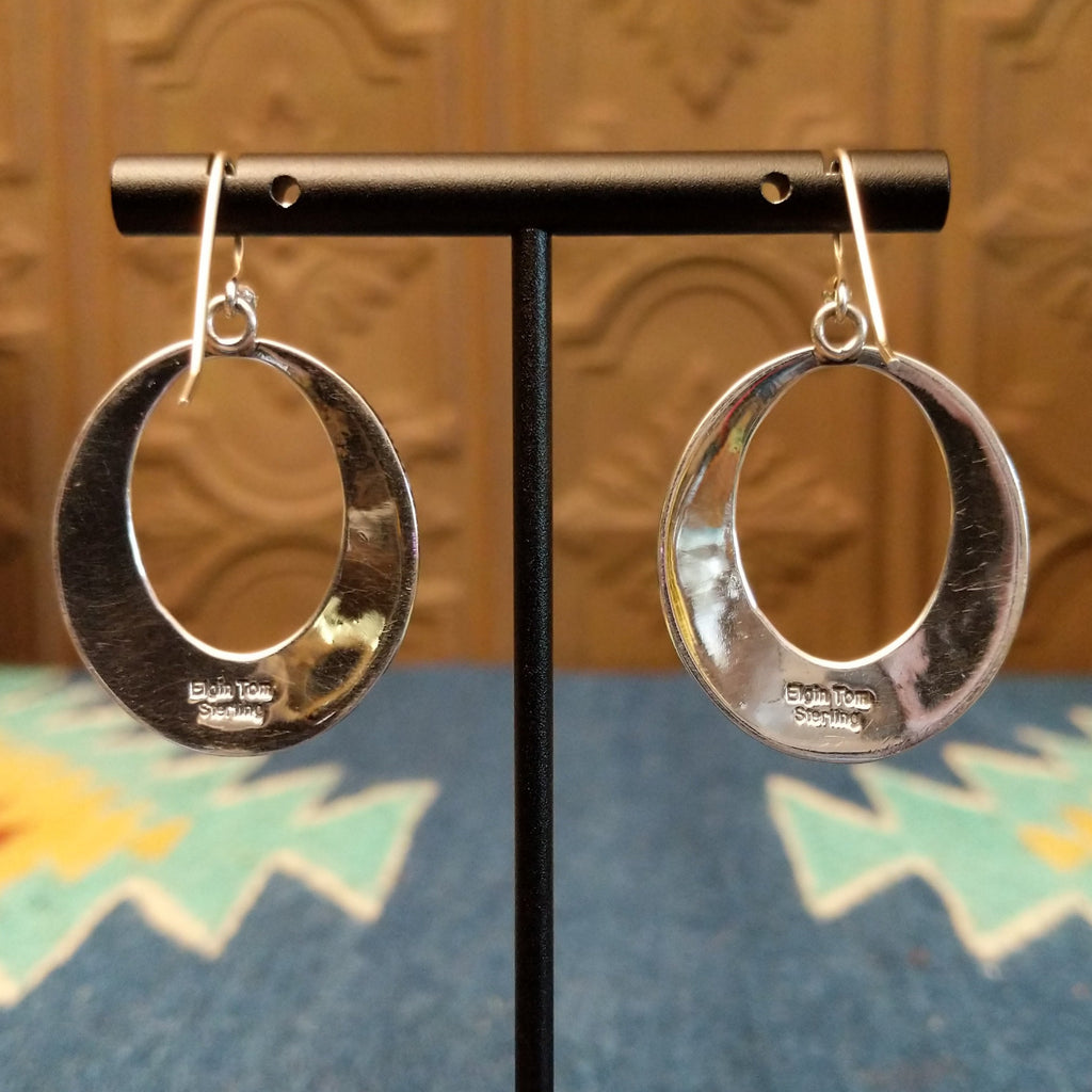 The back of the earrings features the stamp.