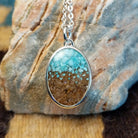 Silver-plated brass necklace with turquoise and San Pedro River sand set in the oval bezel.