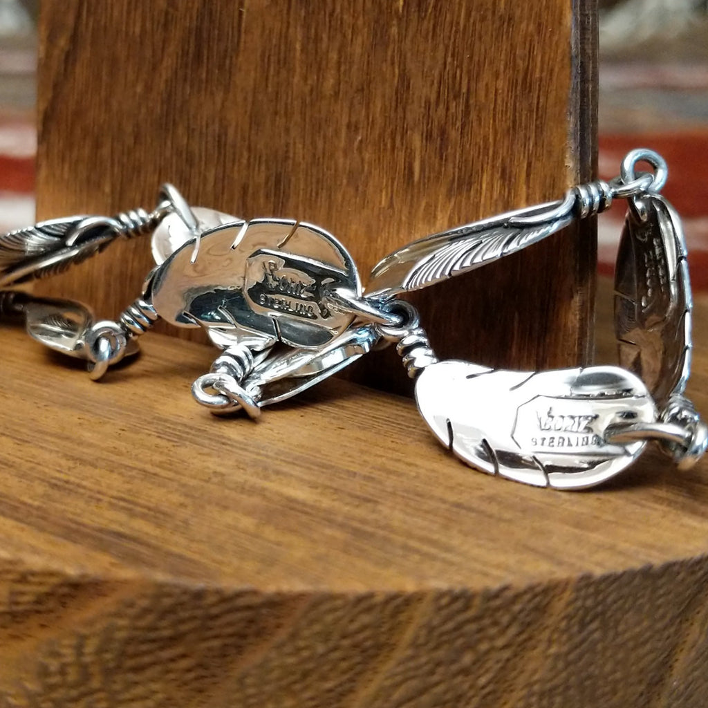 Close-up of the artisan's stamped signature.