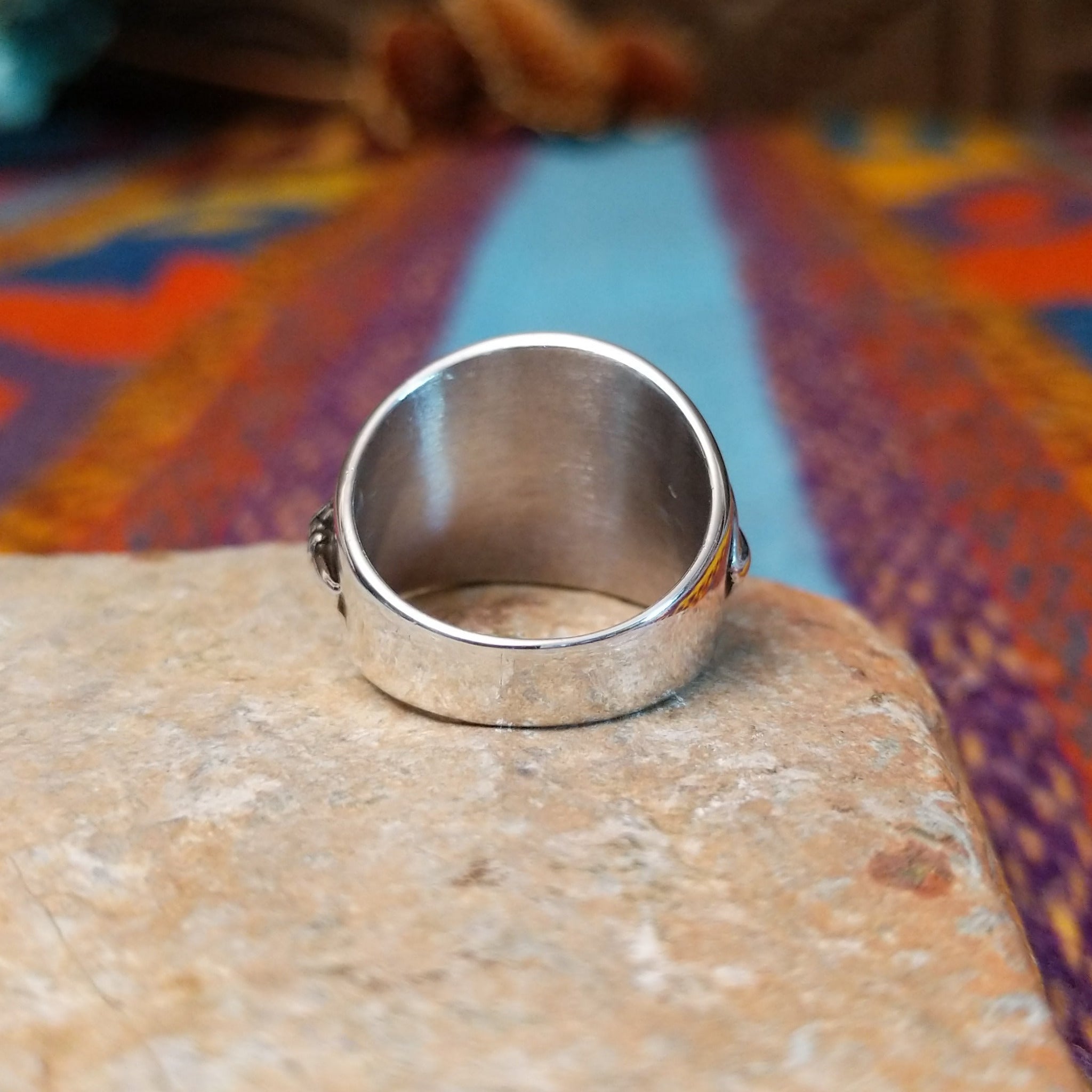 Sterling silver feather ring by L.P. with engraved feather and raised central shaft.
