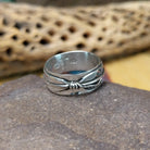 Silver feather ring by Raymond Coriz, featuring a detailed handcrafted feather design in polished sterling silver with traditional Southwestern-inspired craftsmanship.