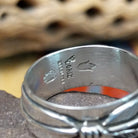 Silver feather ring by Raymond Coriz, featuring a detailed handcrafted feather design in polished sterling silver with traditional Southwestern-inspired craftsmanship.  Artisan and Sterling Silver stamp.