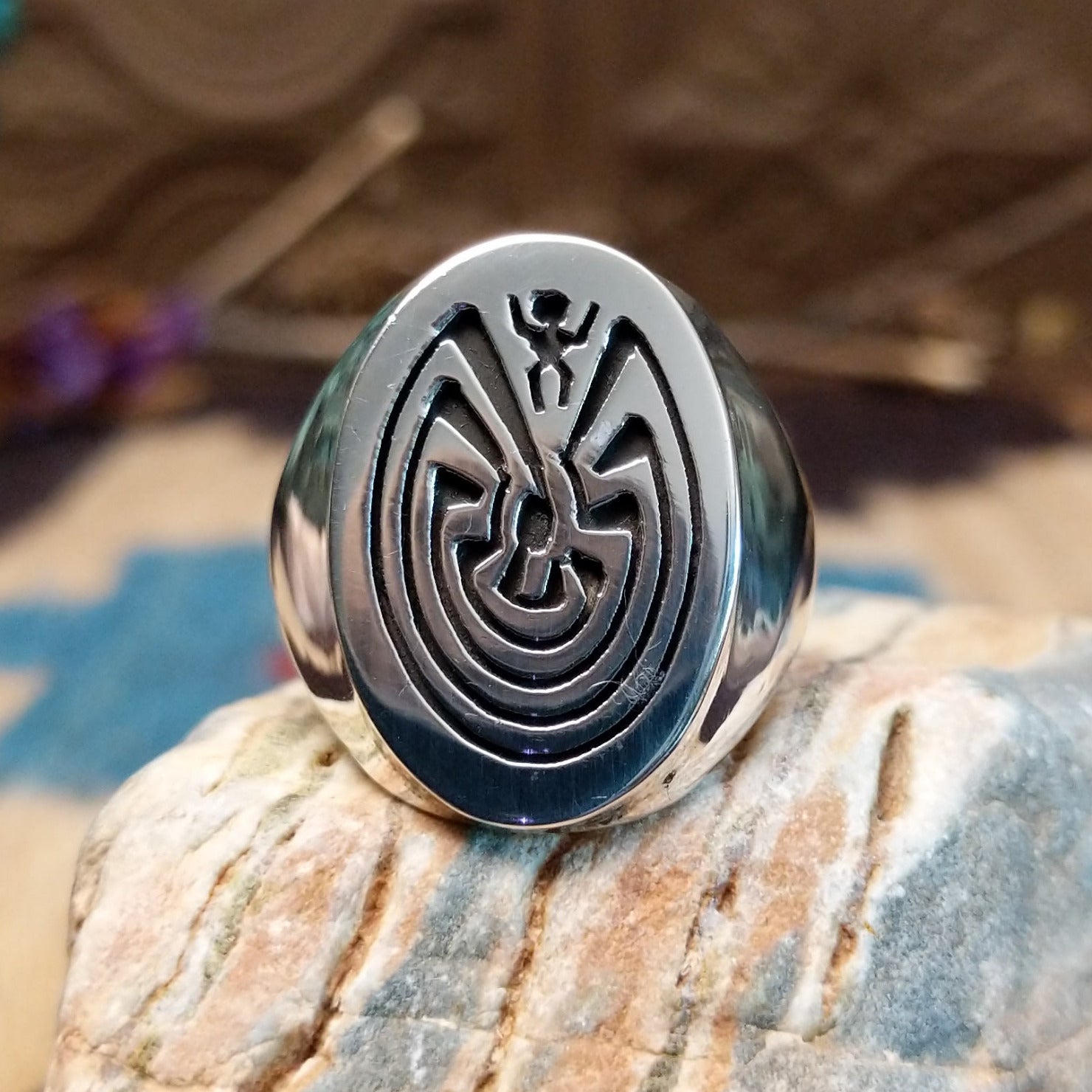 Sterling silver ring with man in the maze motif.