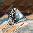 Sterling silver ring with man in the maze motif.