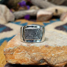 Sterling silver ring by Raymond Coriz with a rectangular hand-stamped geometric design.