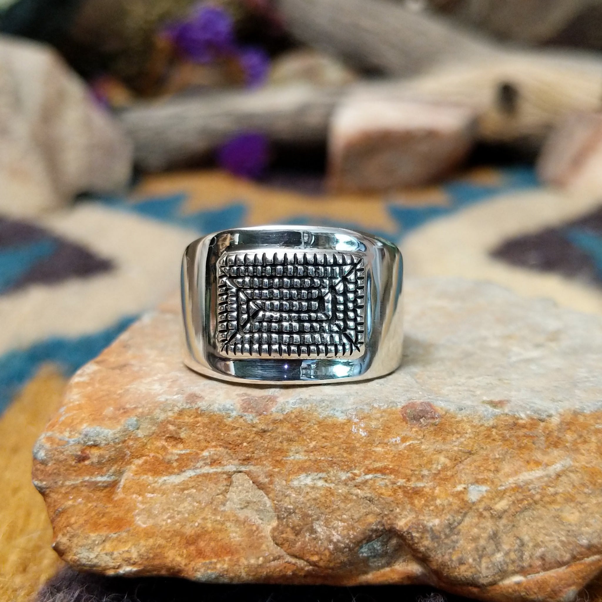 Sterling silver ring by Raymond Coriz with a rectangular hand-stamped geometric design.