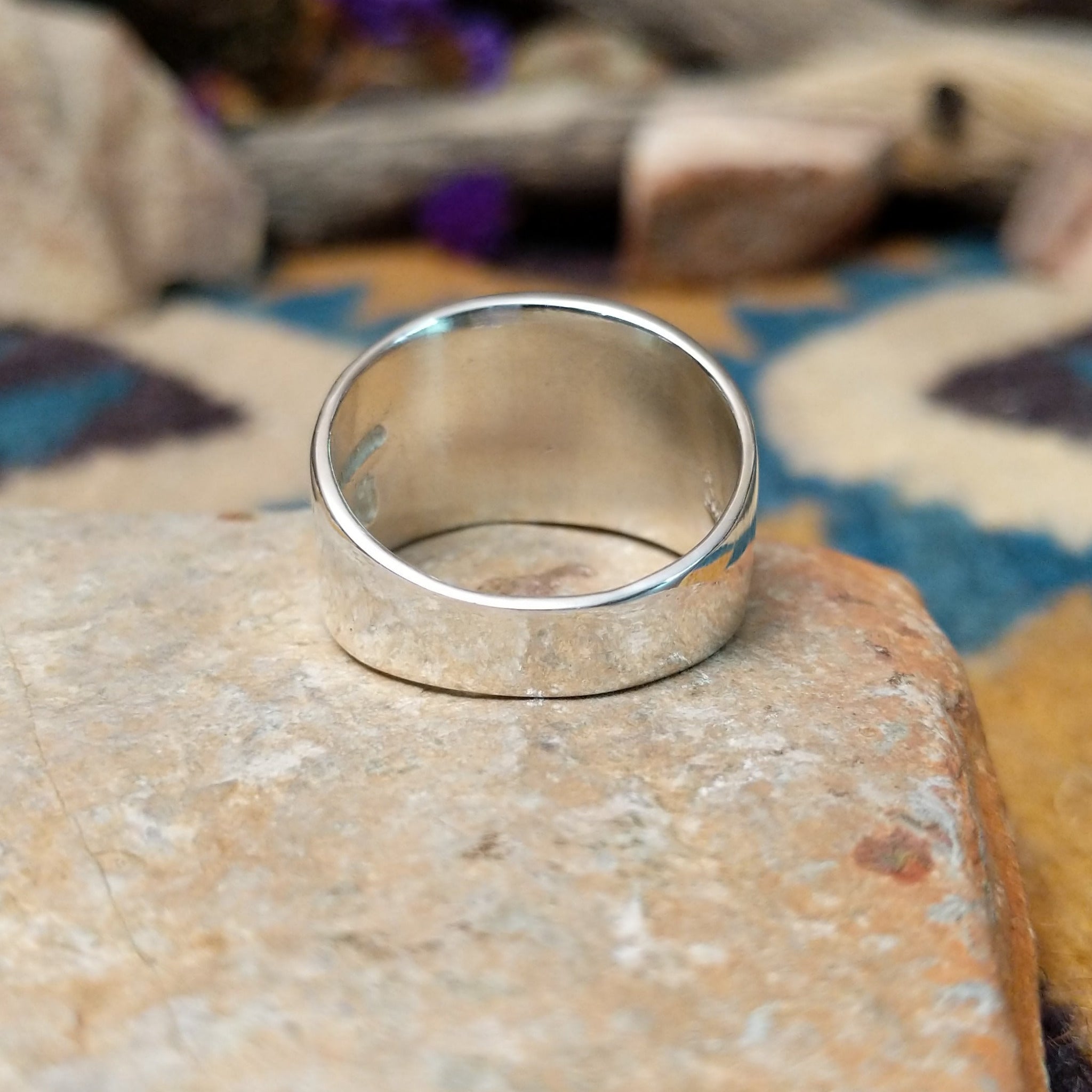 Sterling silver ring by Raymond Coriz with a rectangular hand-stamped geometric design; underside view.
