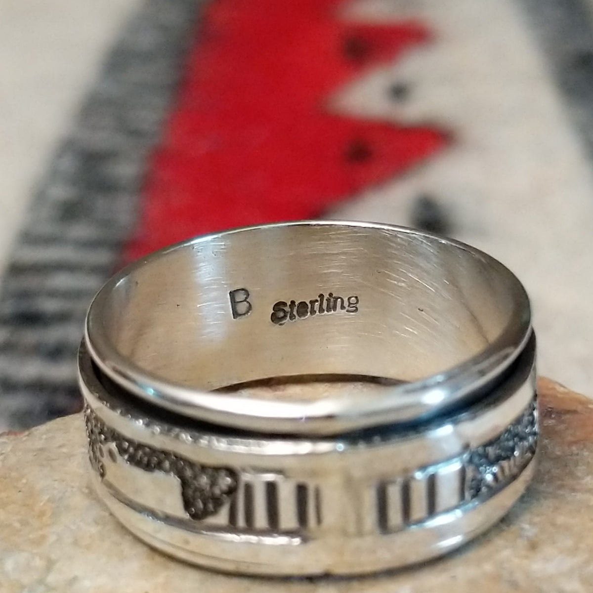 Close up of the artist's stamped signature
