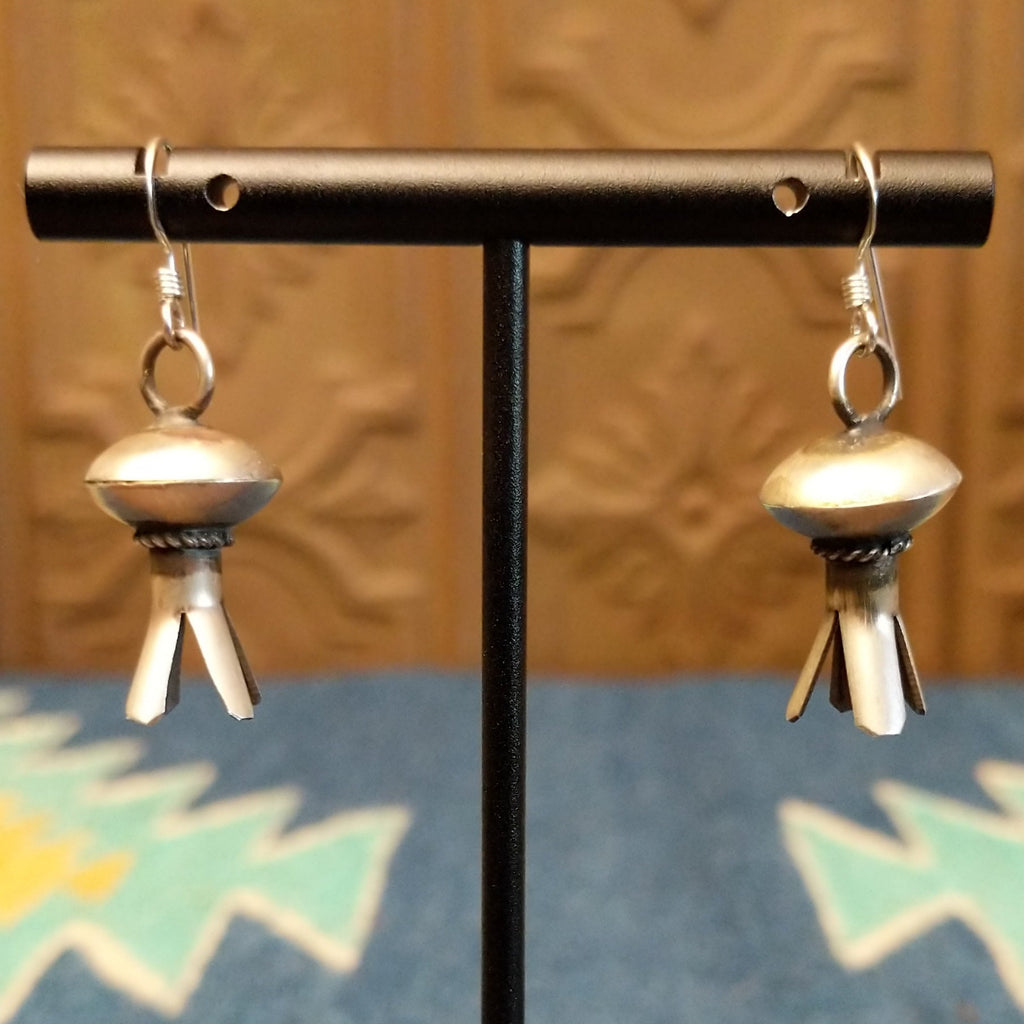 Petal work and floral elements are turned into sterling silver earrings.