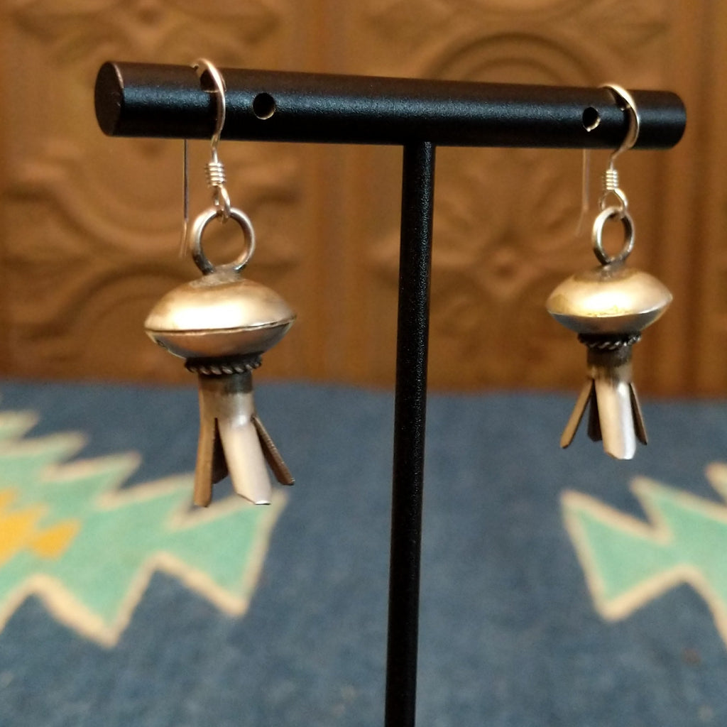 Petal work and floral elements are turned into sterling silver earrings.