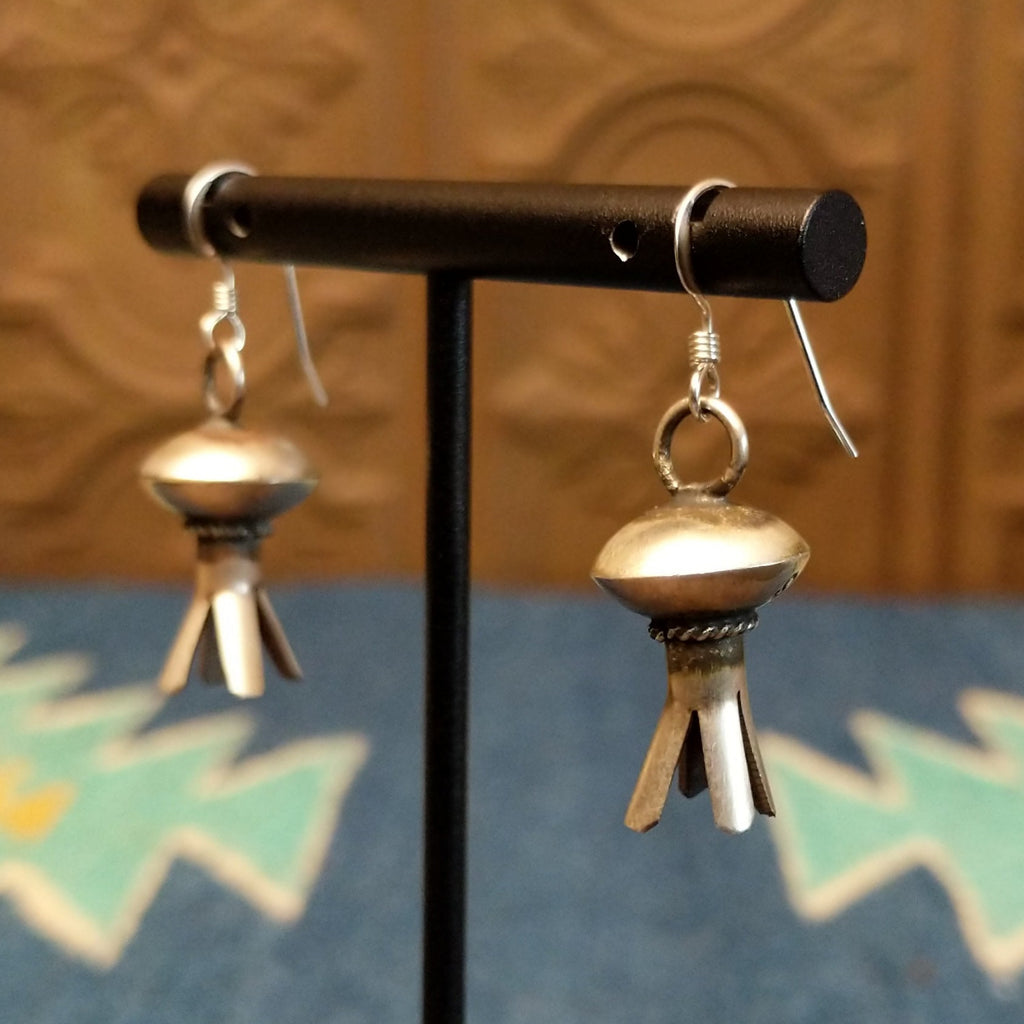 Petal work and floral elements are turned into sterling silver earrings.