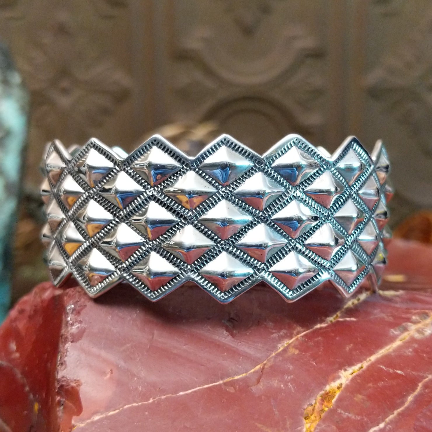 Sterling silver cuff with stud designs.