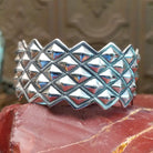 Sterling silver cuff with stud designs.