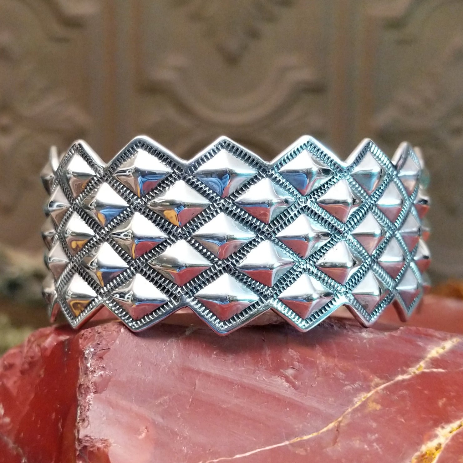 Sterling silver cuff with stud designs.