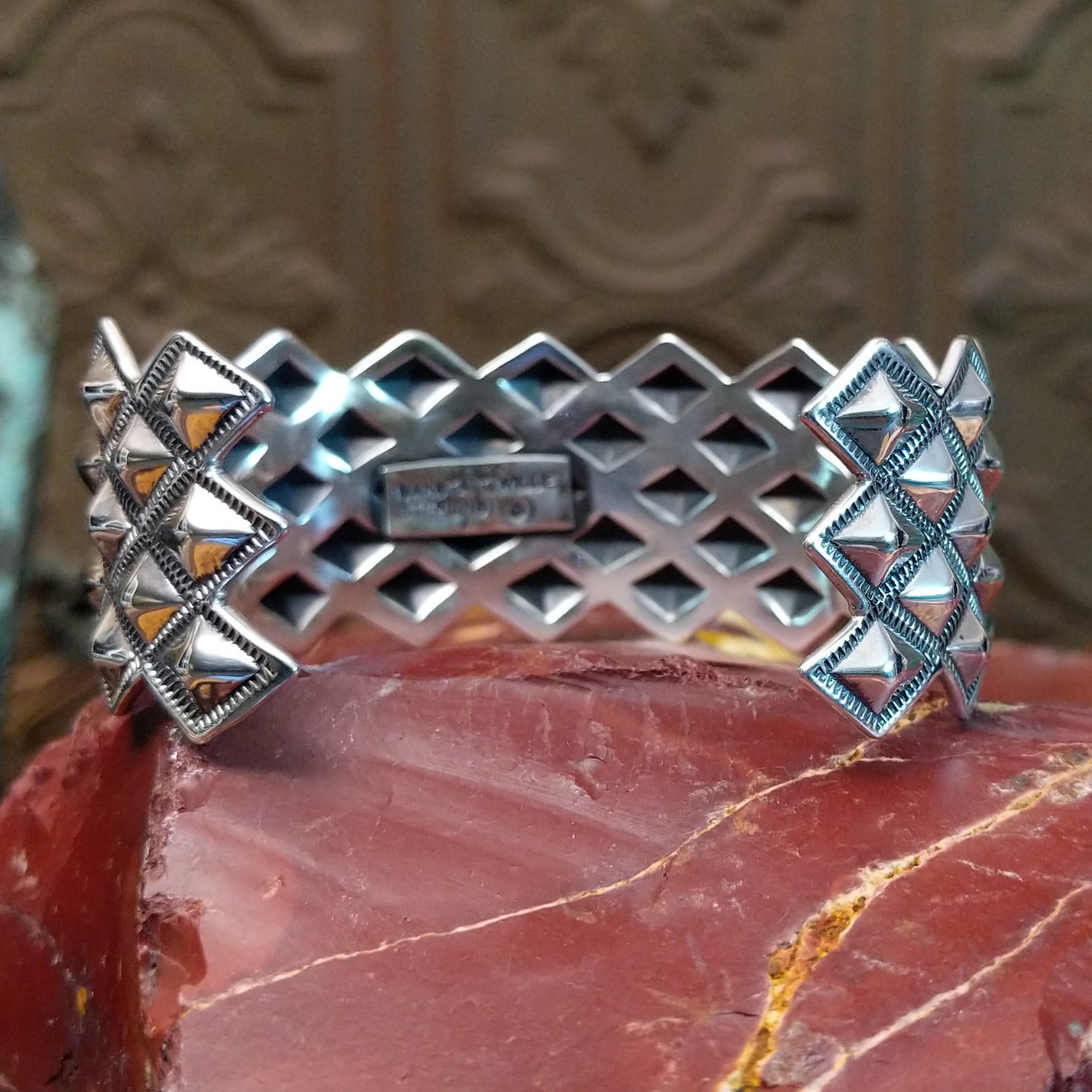 Sterling silver cuff with stud designs.