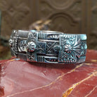 Sterling silver cuff with stamping and thunderbird motif.