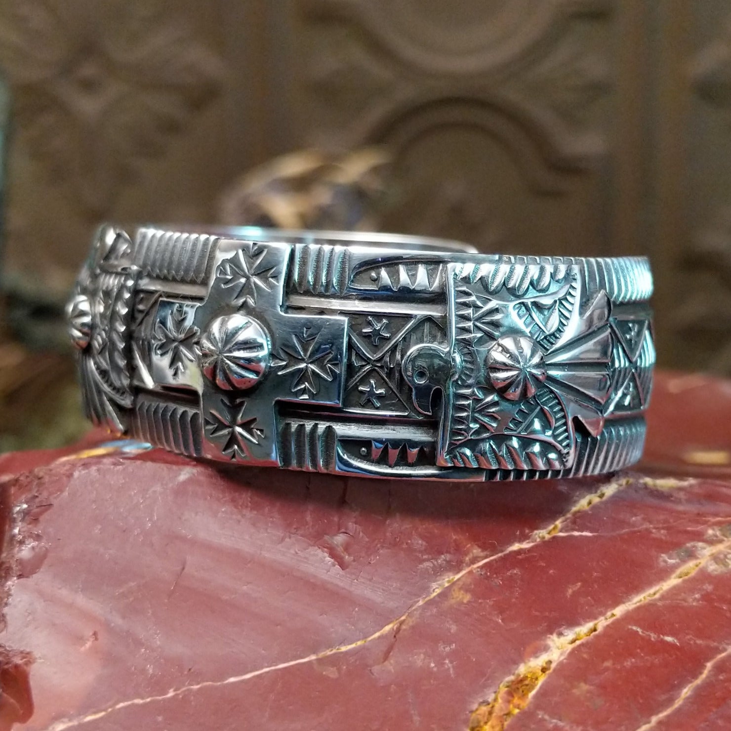 Sterling silver cuff with stamping and thunderbird motif.