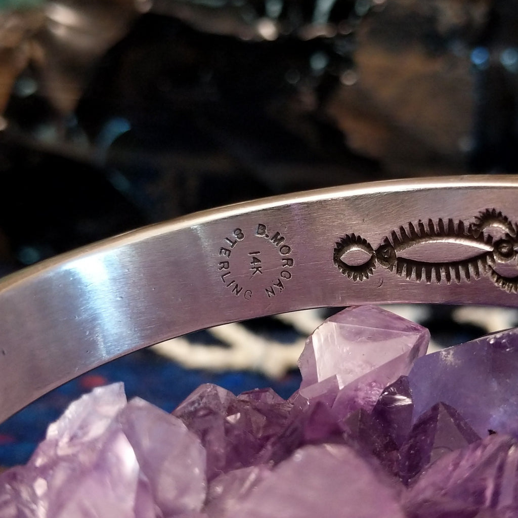 The artist's signature and authentications are found on the inner side of the cuff.