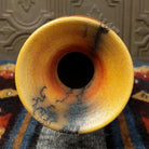 The interior reveals a terracotta finish with faint gray marks.