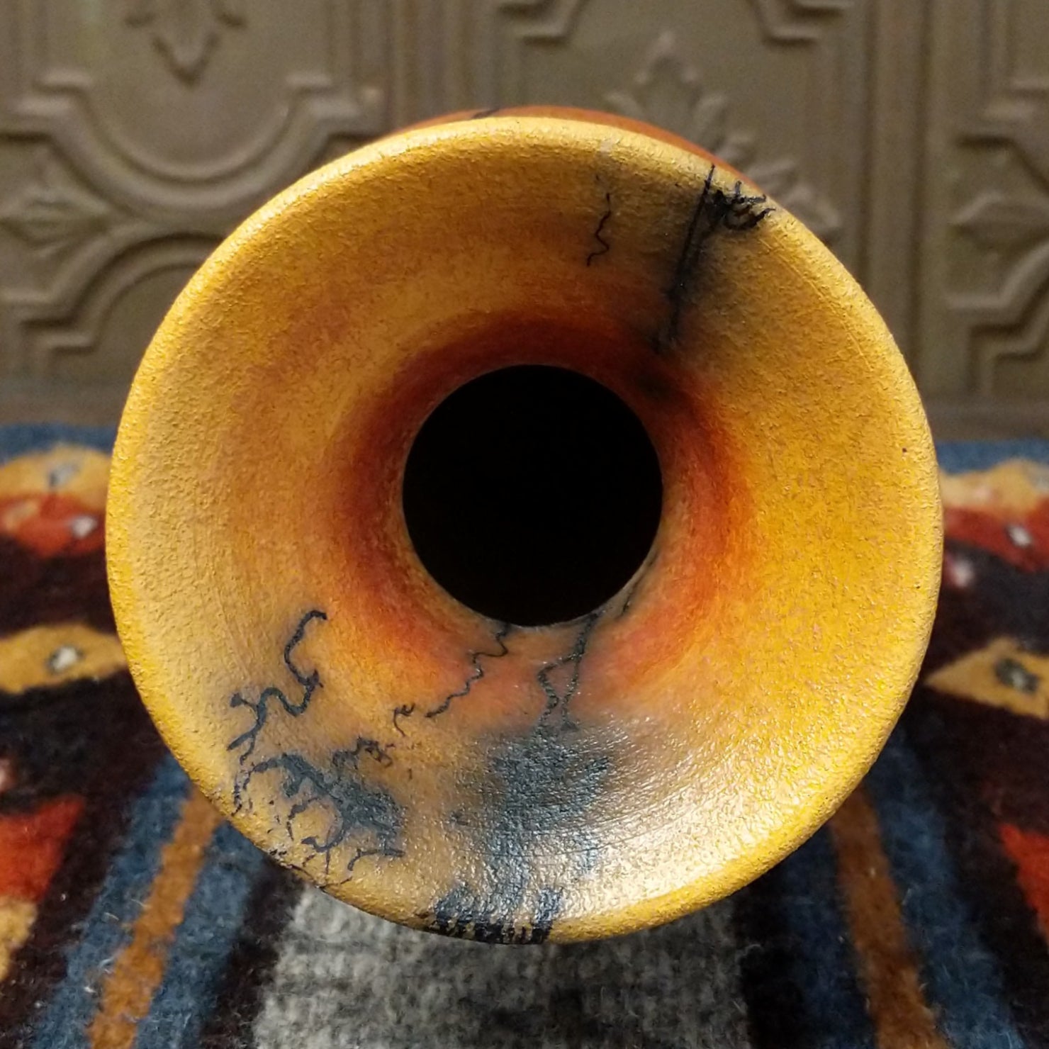 The interior reveals a terracotta finish with faint gray marks.