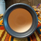 This distinctive Small Horsehair Pottery by Roger Calhoun features a tapered ceramic vessel with natural earth tones, black horsehair patterns, a decorative black-and-white crackled upper section, and a wide black rim; top view.