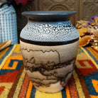 This distinctive Small Horsehair Pottery by Roger Calhoun features a tapered ceramic vessel with natural earth tones, black horsehair patterns, a decorative black-and-white crackled upper section, and a wide black rim.