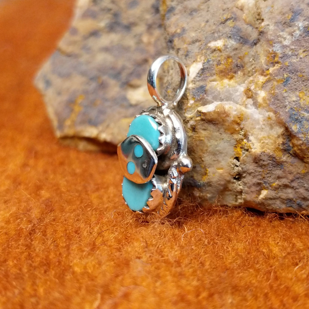 Small turquoise set in sterling silver of the snake pendant.