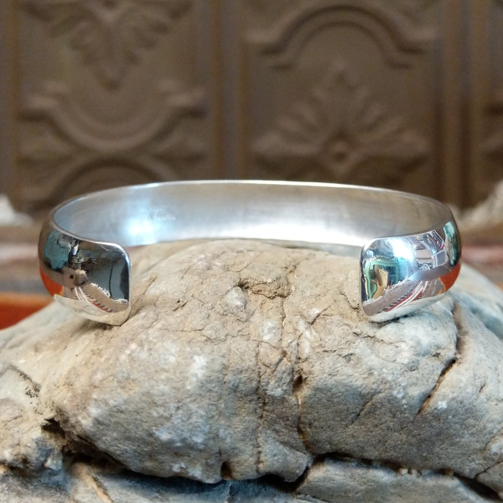 Smooth sterling silver cuff with polished finish.