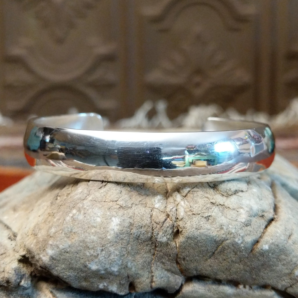 Smooth sterling silver cuff with polished finish.