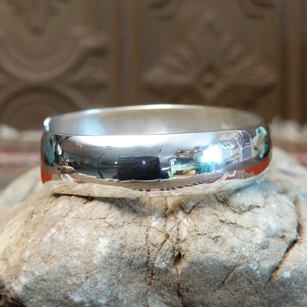 Smooth sterling silver cuff with polished finish.