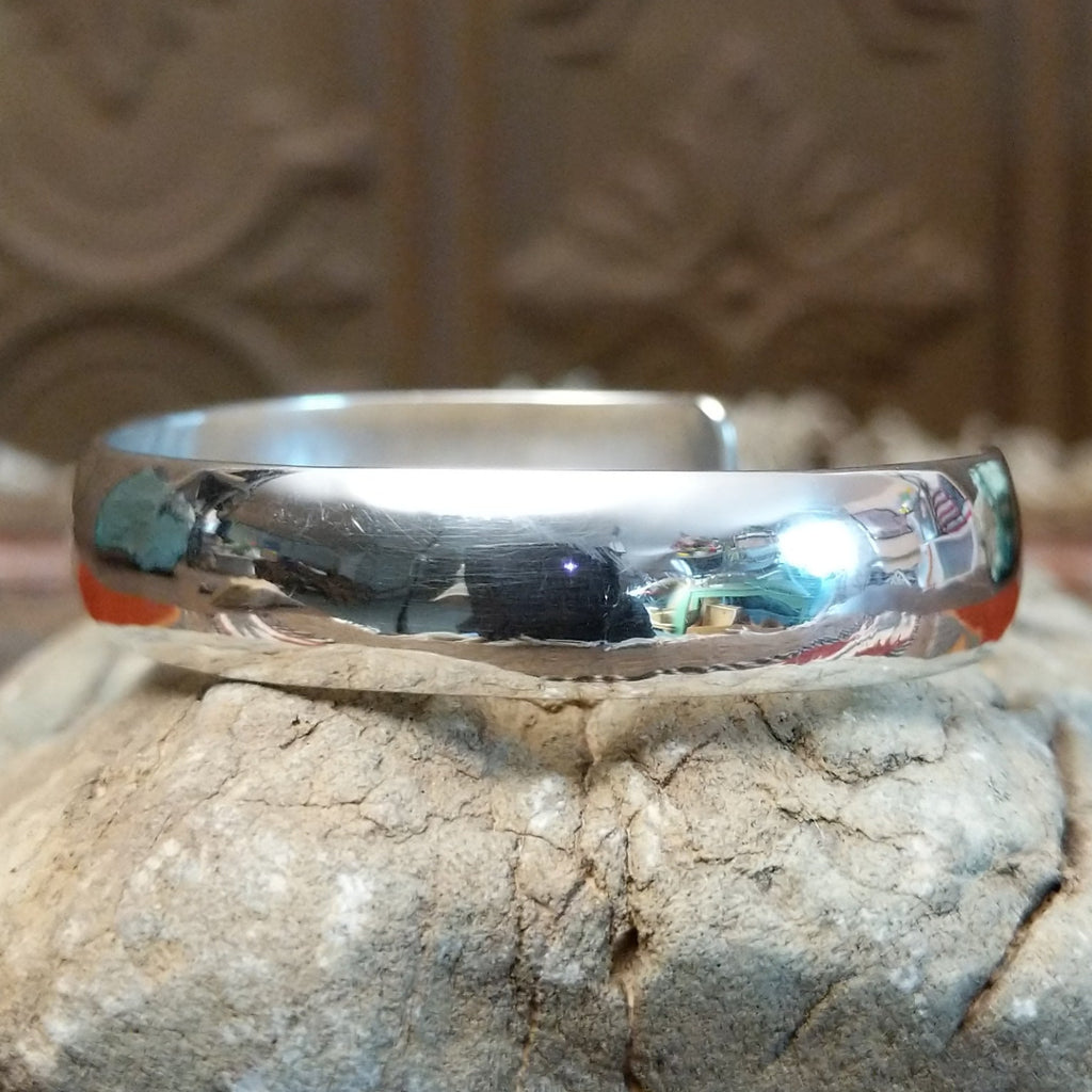 Smooth sterling silver cuff with polished finish.