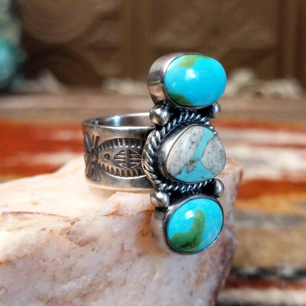 Sterling silver stacked ring with sonoran gold turquoise and boulder turquoise set in the bezels, featuring twisted rope and dotted accents.