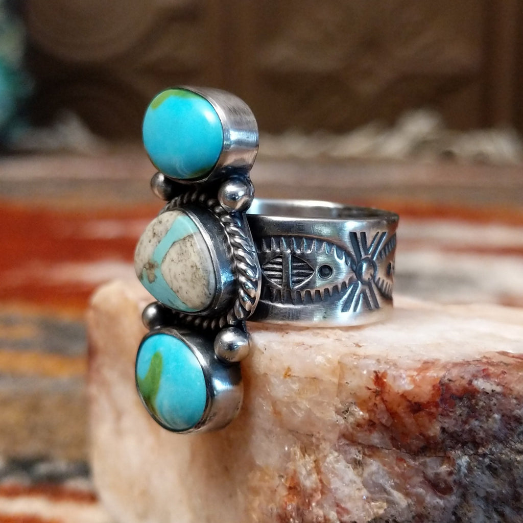 Sterling silver stacked ring with sonoran gold turquoise and boulder turquoise set in the bezels, featuring twisted rope and dotted accents.