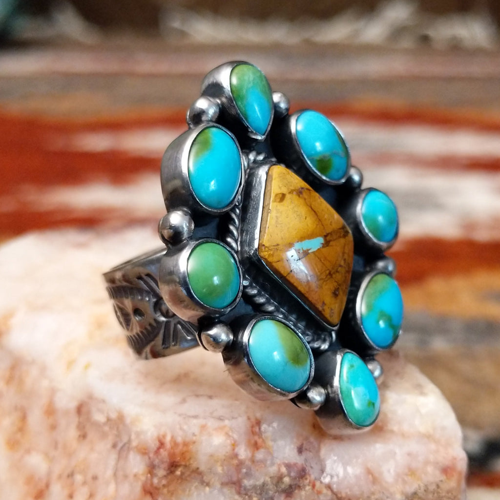 Diamond shaped sterling silver ring with Sonoran gold cabochons and twisted rope centerpiece with boulder turquoise.