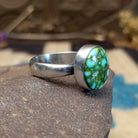 Sterling silver ring with Sonoran gold turquoise set in a round bezel.