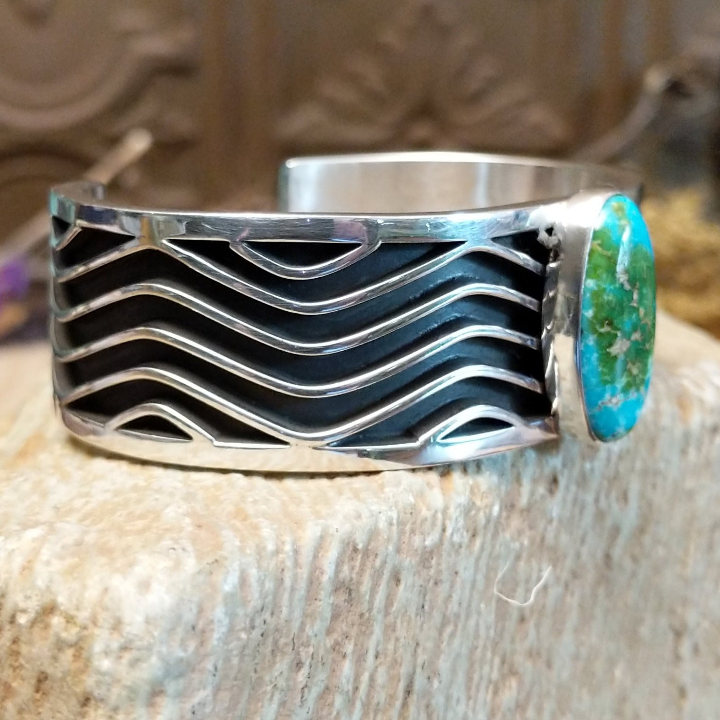 Sterling silver cuff with Sonoran gold turquoise set in an oval bezel and wavey silverwork along the band.