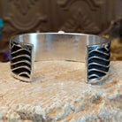 Sterling silver cuff with Sonoran gold turquoise set in an oval bezel and wavey silverwork along the band.