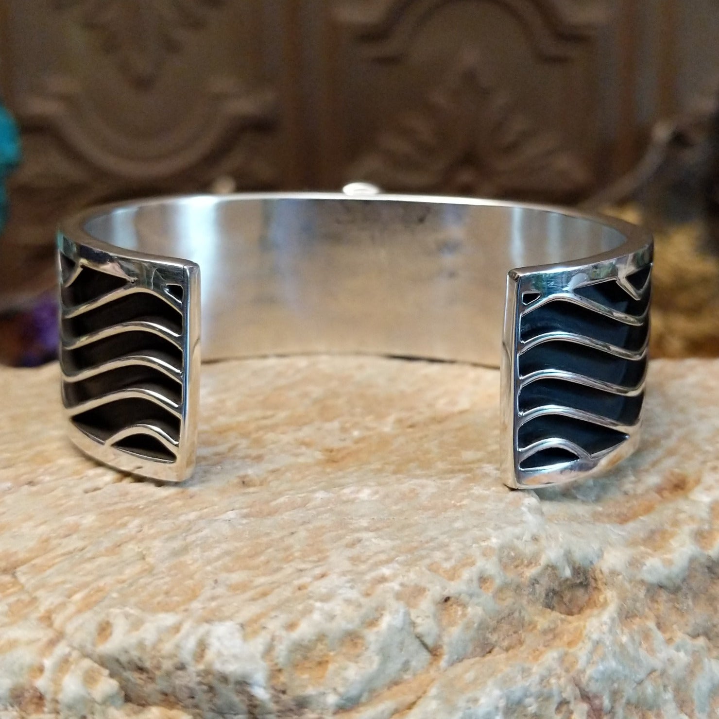 Sterling silver cuff with Sonoran gold turquoise set in an oval bezel and wavey silverwork along the band.