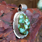 Sterling silver pendant with sonoran gold turquoise framed by twisted rope and stamped accents.