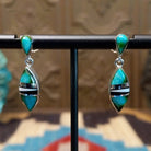 Sterling silver drop earrings with a multistone inlay. 