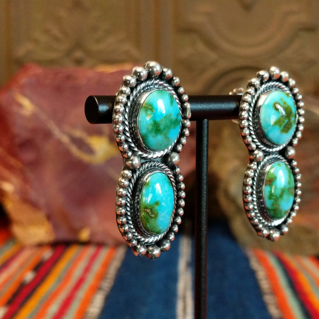 Sonoran Gold turquoise set in twisted rope bezels with intricate dot work on the pair of the earrings.