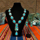Sonoran Gold turquoise set in twisted rope bezels with intricate dot work linked together and matching earrings.