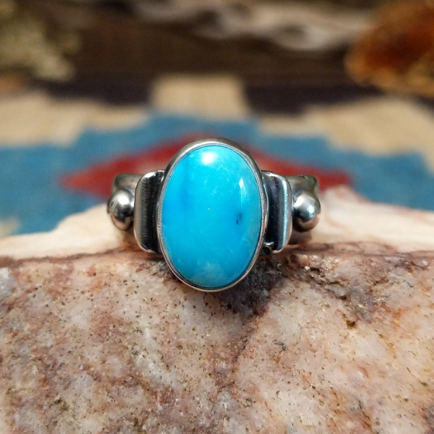 Sterling silver ring with Sonoran gold turquoise set in the raised bezel.