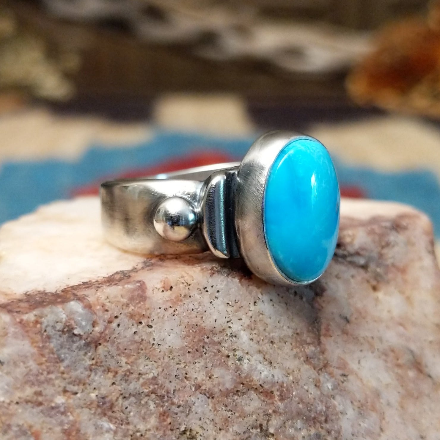 Sterling silver ring with Sonoran gold turquoise set in the raised bezel.