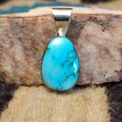 Sterling silver pendant with Sonoran gold turquoise set in an ovate bezel.