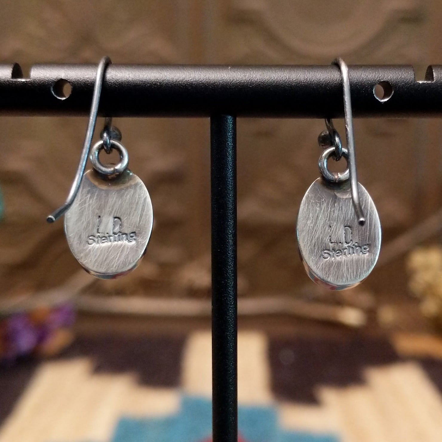 Close-up of the artisan's stamped signature.