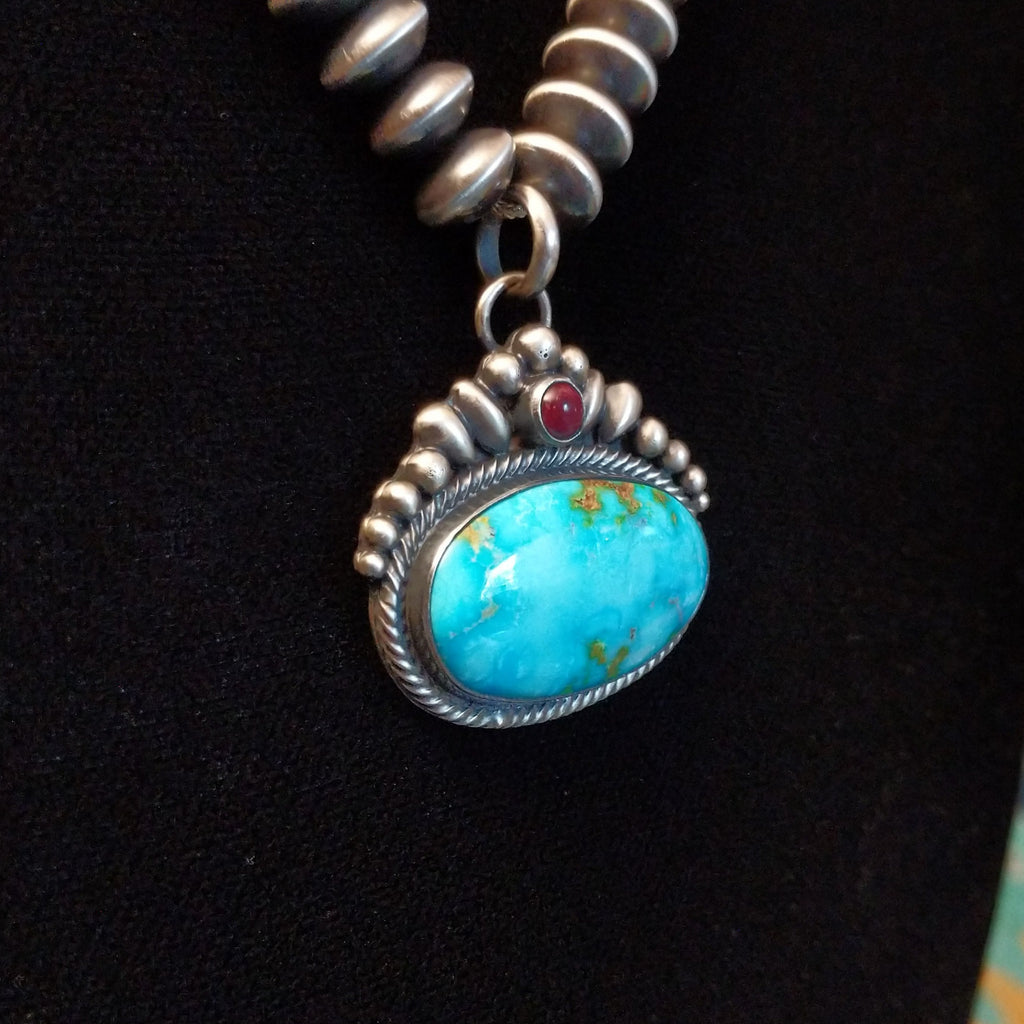 Sonoran Gold Turquoise and purple spiny oyster shell set in intricate setting with twisted rope accent and beaded sterling silver chain.